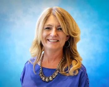 Portrait of Suzanne Crimmins, Owner / NYS Licensed Real Estate Broker